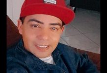 foto de homem encontrado morto com tiros no rosto em Garuva, ele sorri e usa um boné vermelho